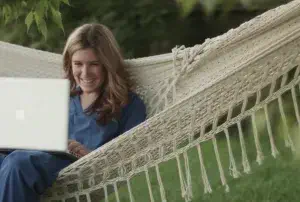 woman in a hammock with a laptop