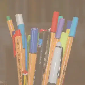 group of pens and pencils