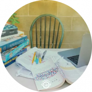 empty chair next to desk with books