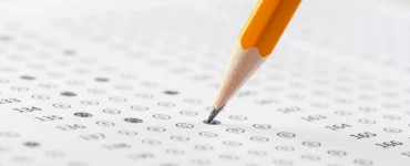 pencil filling in scantron bubbles